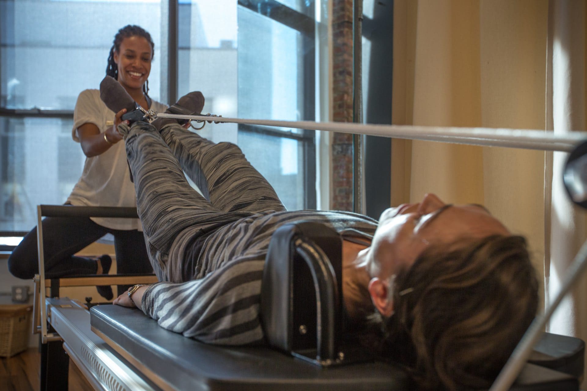 Physical Therapist Using Pilates Reformer | Physical Therapist Using Pilates-Based Physical Therapy | https://physiologicnyc.com/physical-therapy/