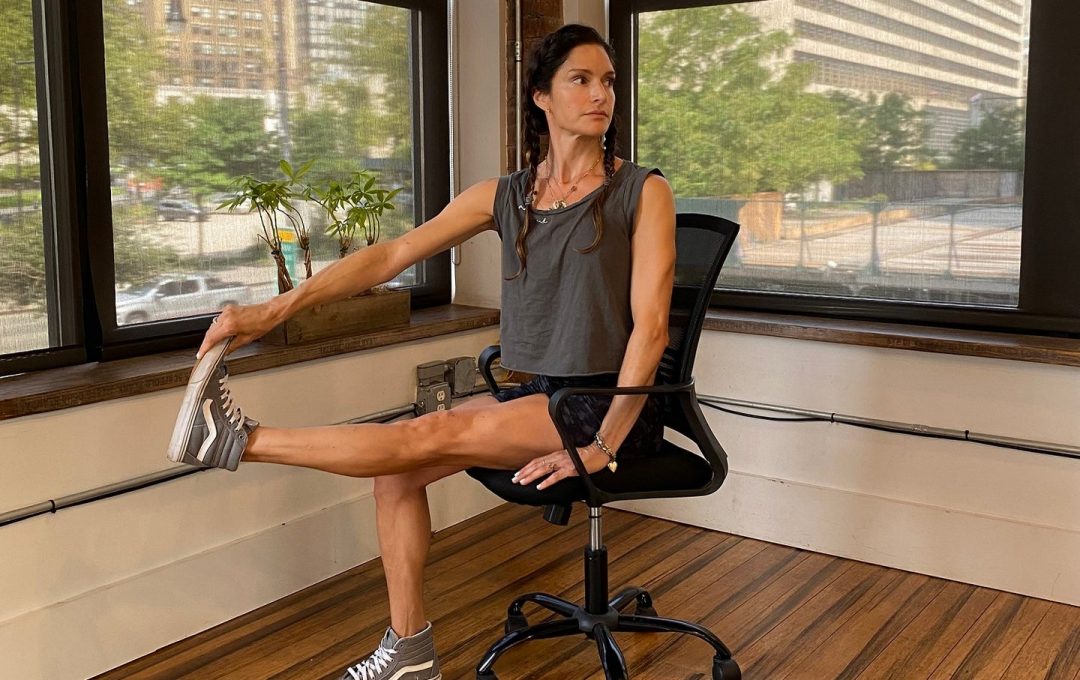 Lynda Gehrman performs desk exercises in Brooklyn NY.