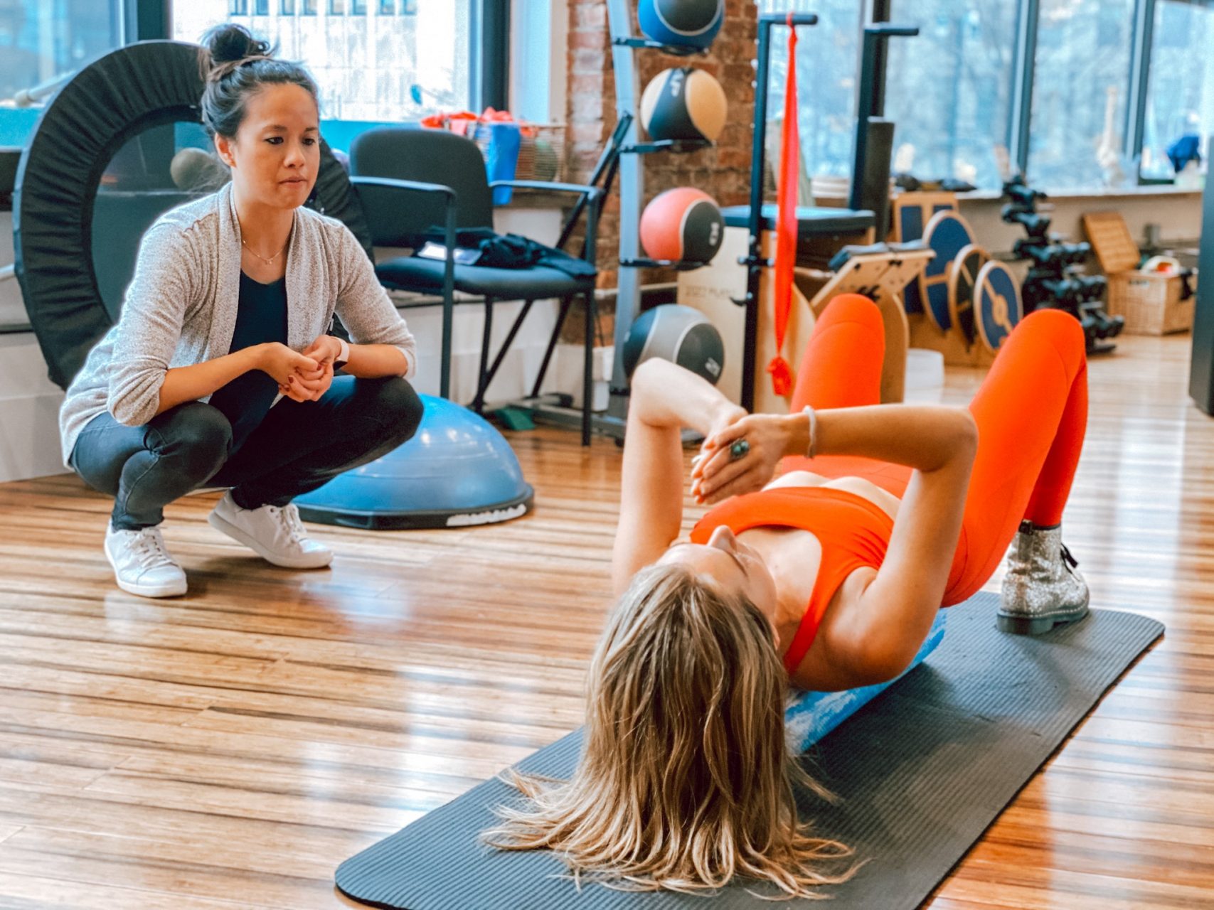 Dr. Sarah Rodriguez, DPT, Physical Therapist, monitors a patient during a Physical Therapy session at Physio Logic NYC's Brooklyn, NY location.