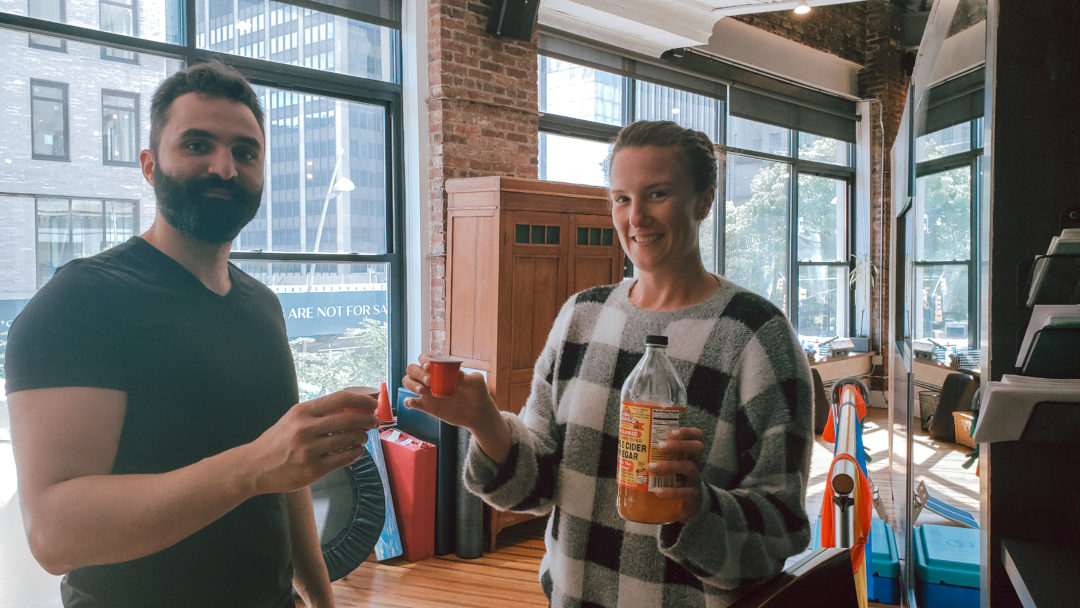 Megan and Akaki of Physio Logic NYC enjoying the health benefits of apple cider vinegar with a daily shot of ACV in Brooklyn, NY.