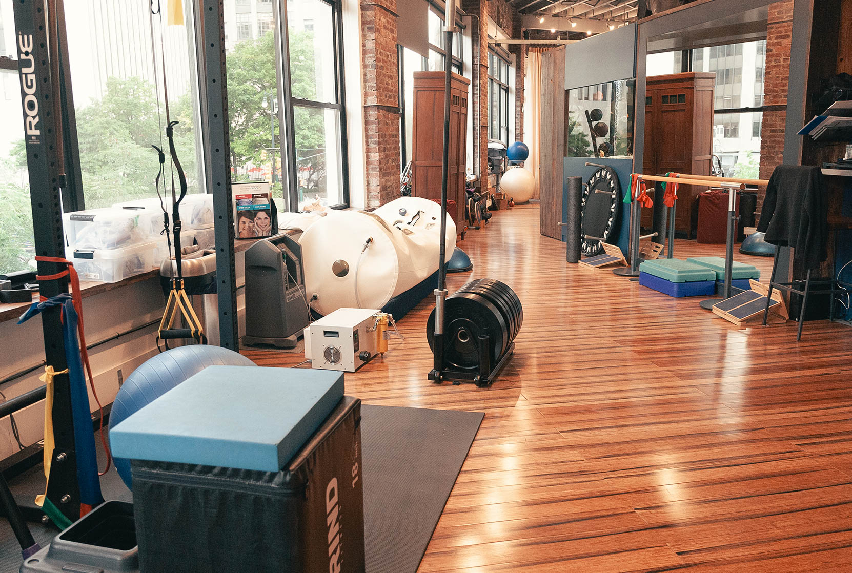 Physical therapy in Brooklyn featuring various rehabilitation equipment and therapy tools in a modern clinic setting